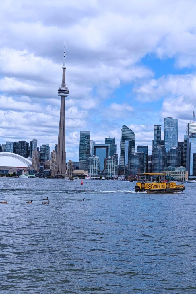 Toronto skyline from Centre island, with a Toronto water taxi cruising by