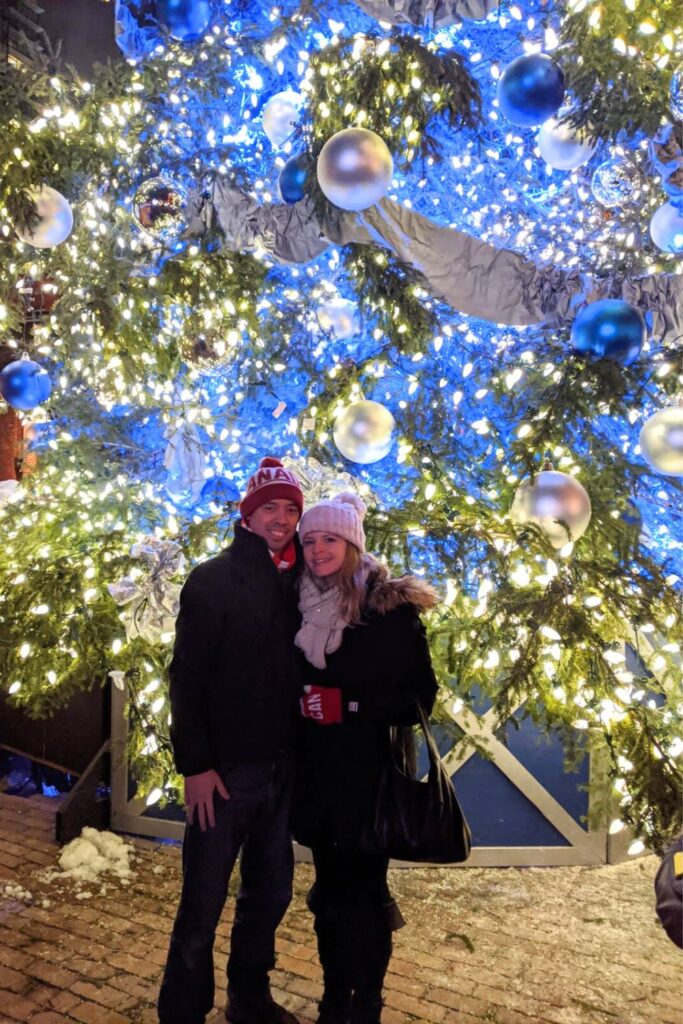 In front of the Distillery District Winter Village during Christmas in Toronto