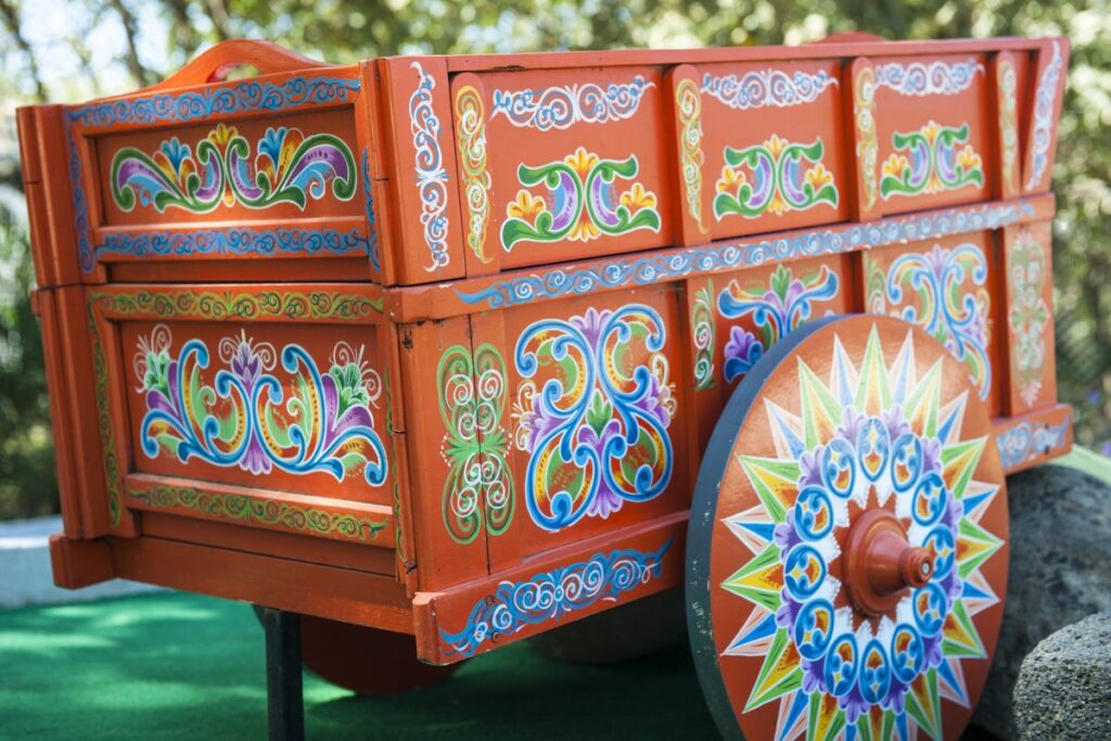 a hand painted wooden oxcart