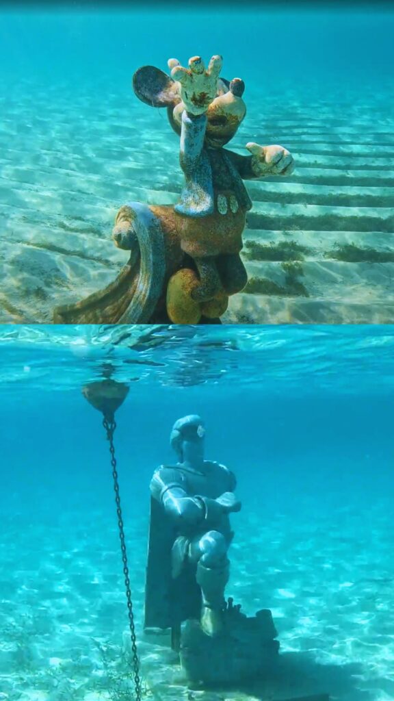 statues found underwater from snorkeling at Castaway Cay. Mickey on the top and Prince Eric statue on the bottom