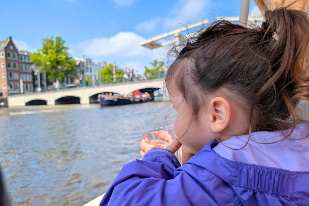 child looking over the amsterdam canal