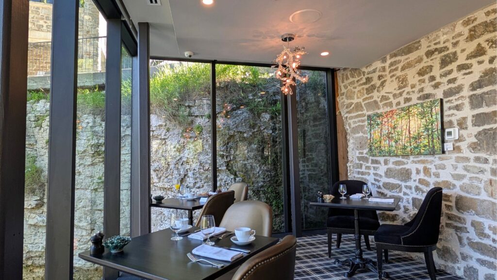 Lower area of the Elora Mill Restaurant with the limestone rocks behind it