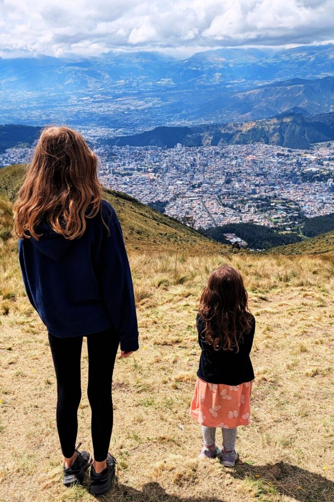 kids looking out over Quito from Pinchincha volcano