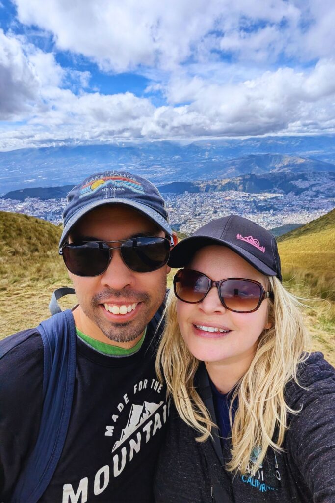 a couple with a view of Quito from Pichincha volcano