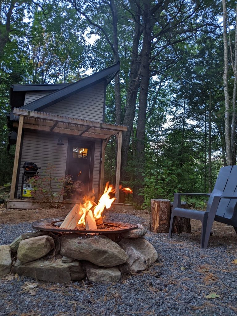 a fire pit and chairs outside Westcliff Cabin in Muskoka
